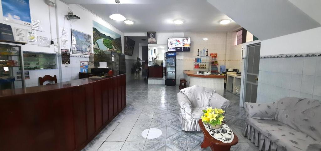 Posezení v ubytování Hostal Las Palmeras