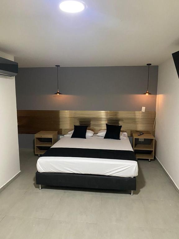 Postel nebo postele na pokoji v ubytování HOTEL ESTADIO DORADO