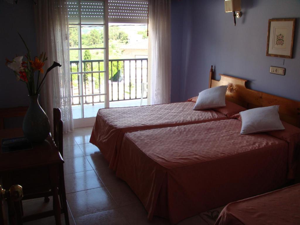 Postel nebo postele na pokoji v ubytování Hotel Vimar