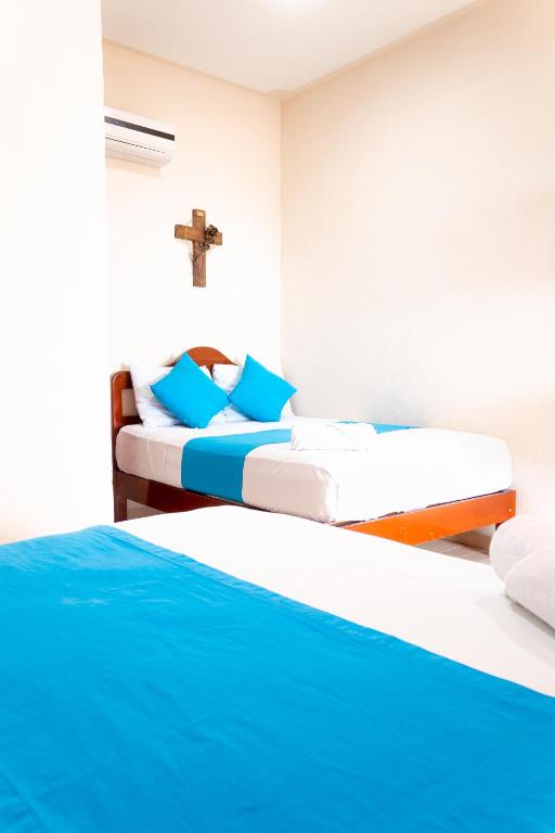 Postel nebo postele na pokoji v ubytování Hotel Bacalar Magico