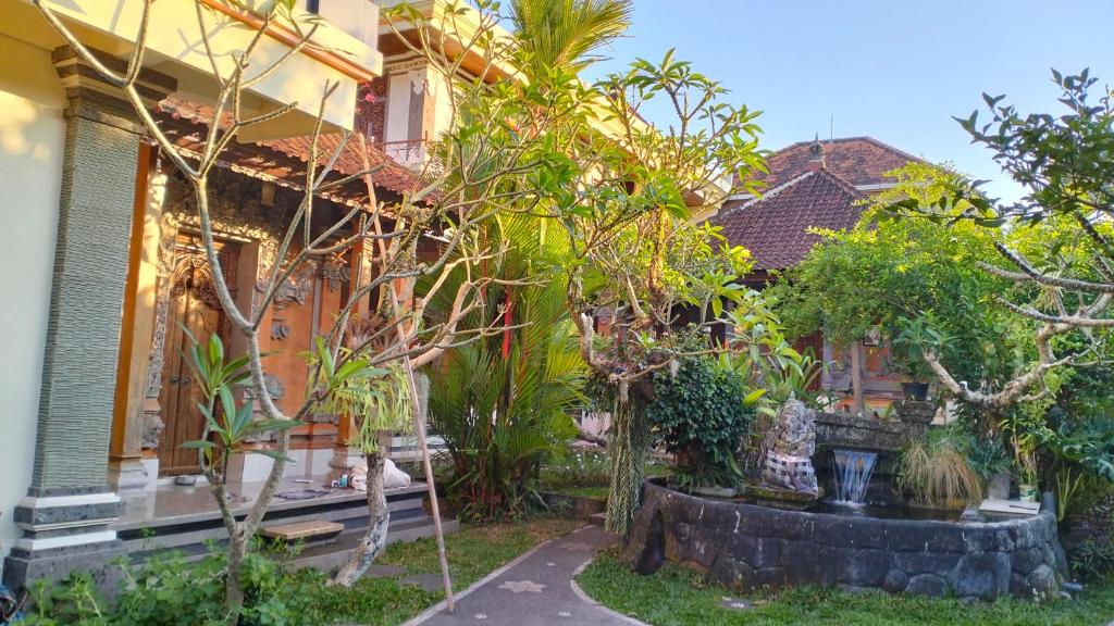 a house with a garden in front of it at Uma Pejeng in Ubud