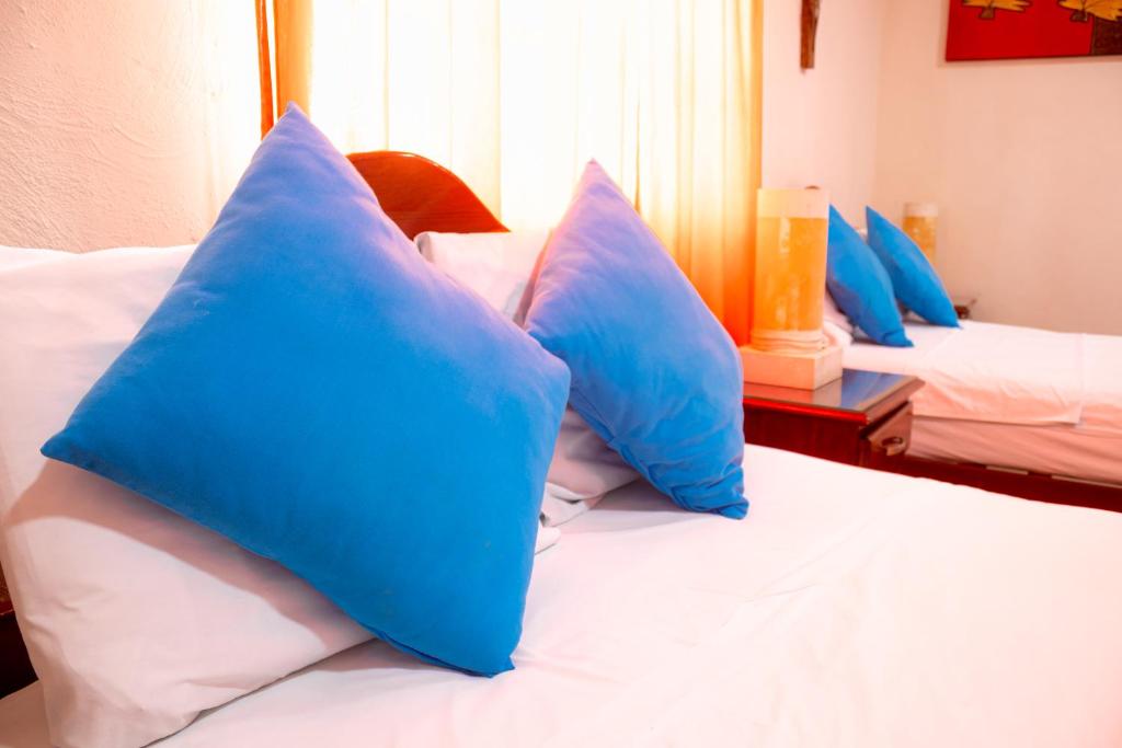 Postel nebo postele na pokoji v ubytování Hotel Bacalar Magico