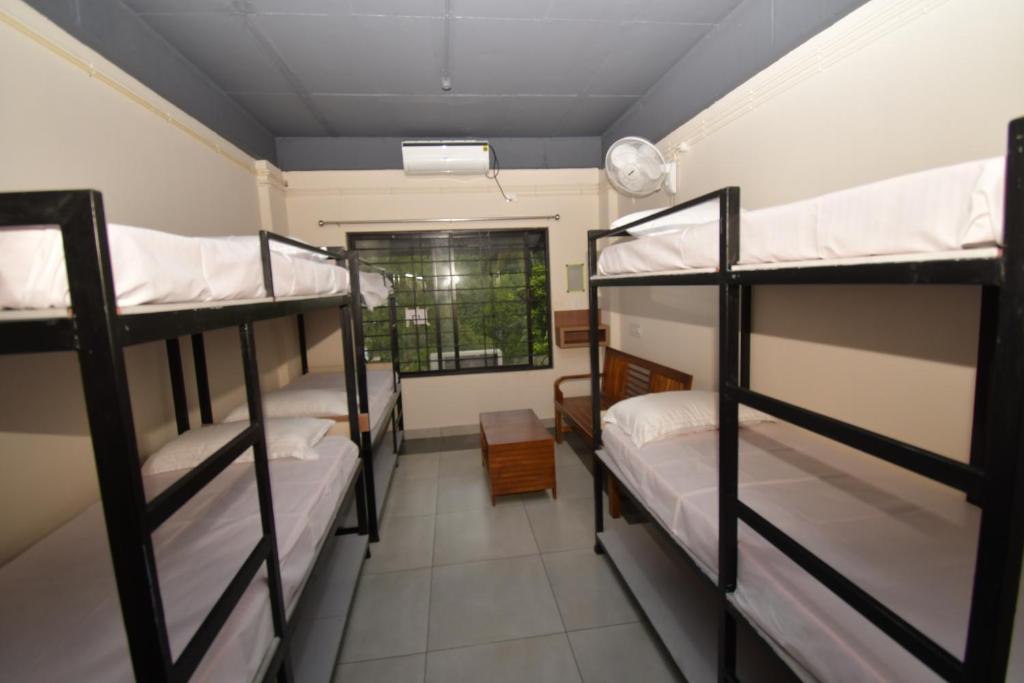 Postel nebo postele na pokoji v ubytování ARAKKAL GUESTHOUSE