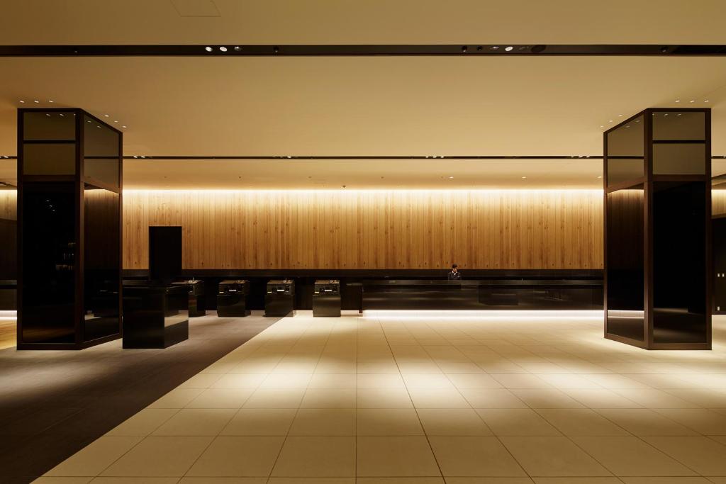 a large room with a large wall with lights at Hotel Gracery Shinjuku in Tokyo