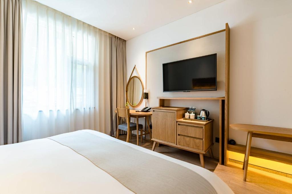 TV a/nebo společenská místnost v ubytování Yoba Boutique Hotel