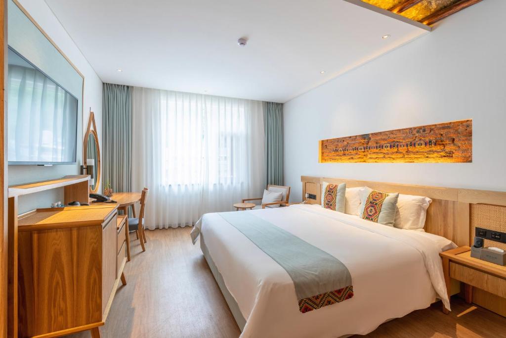 Postel nebo postele na pokoji v ubytování Yoba Boutique Hotel