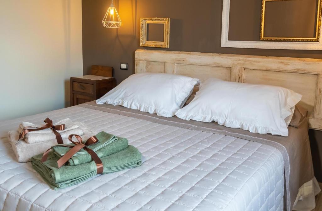 Postel nebo postele na pokoji v ubytování Palazzo NiTe