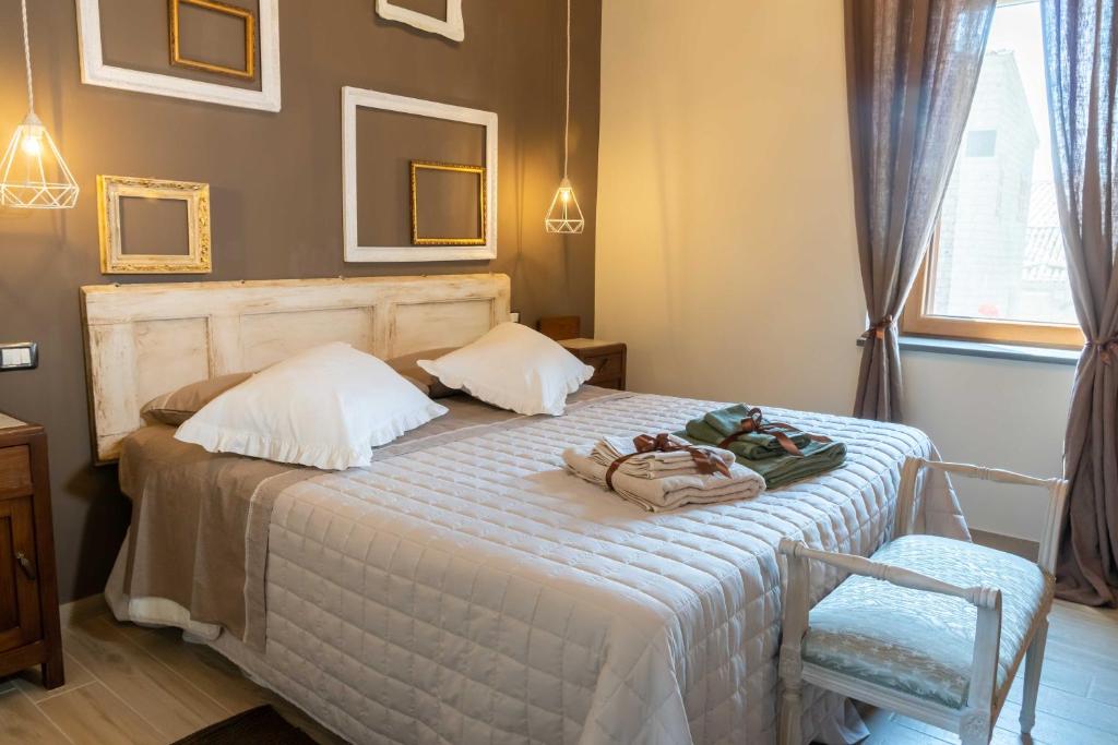 Postel nebo postele na pokoji v ubytování Palazzo NiTe