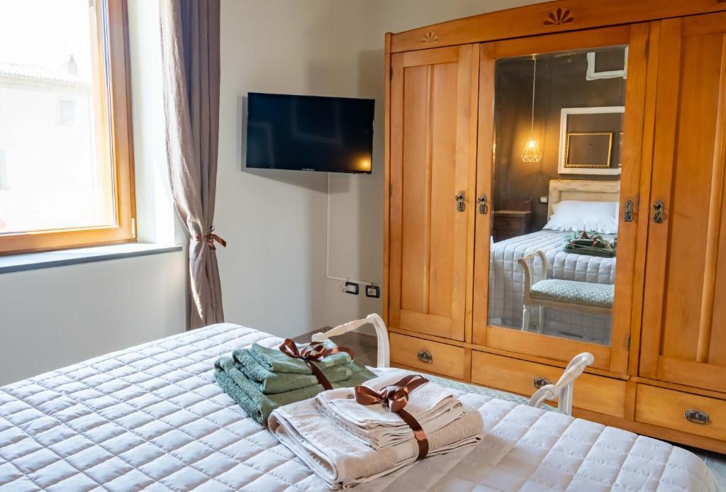 Postel nebo postele na pokoji v ubytování Palazzo NiTe
