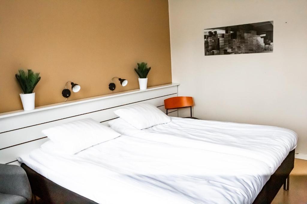 Postel nebo postele na pokoji v ubytování Spångholmen Bed & Breakfast AB
