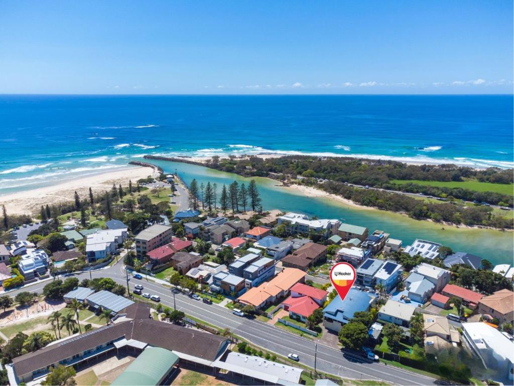 an aerial view of a suburb next to the beach at Luna Sea Kingscliff with Ocean Glimpses in Kingscliff