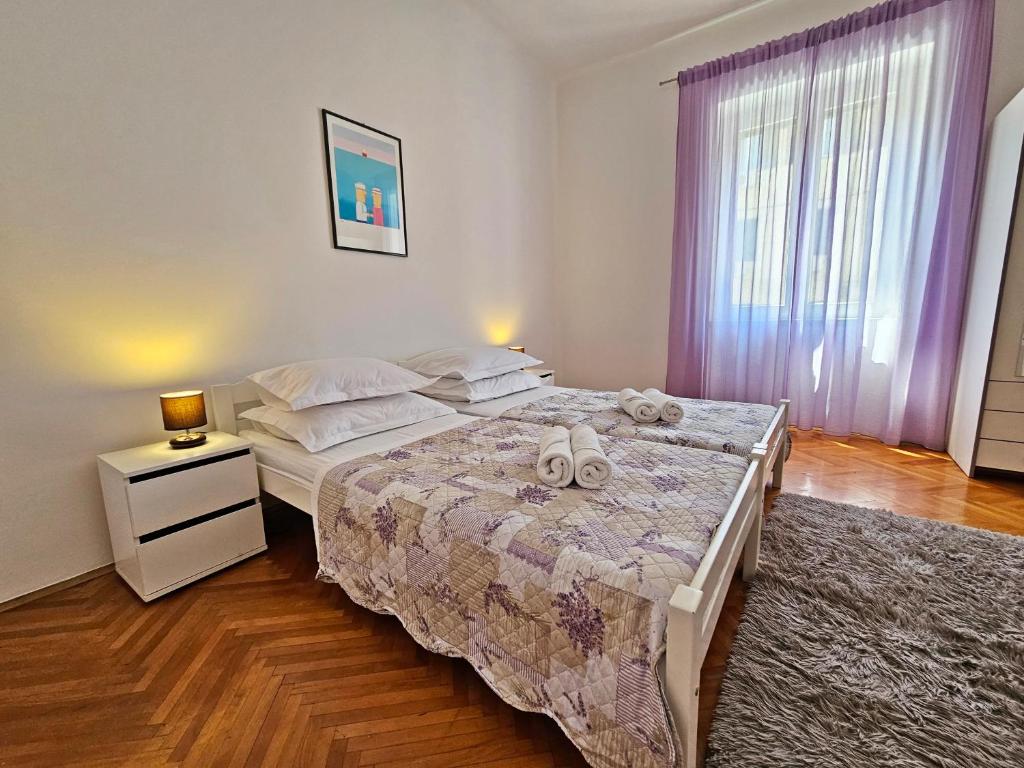 Postel nebo postele na pokoji v ubytování Apartment Nina Marie