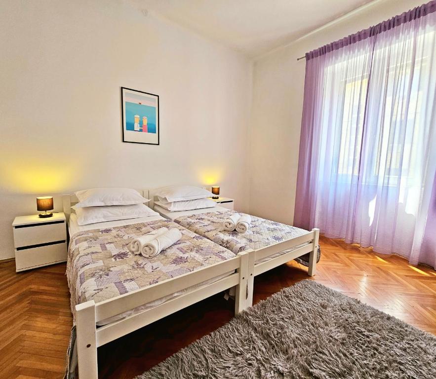 Postel nebo postele na pokoji v ubytování Apartment Nina Marie