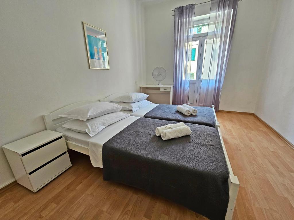 Postel nebo postele na pokoji v ubytování Apartment Nina Marie