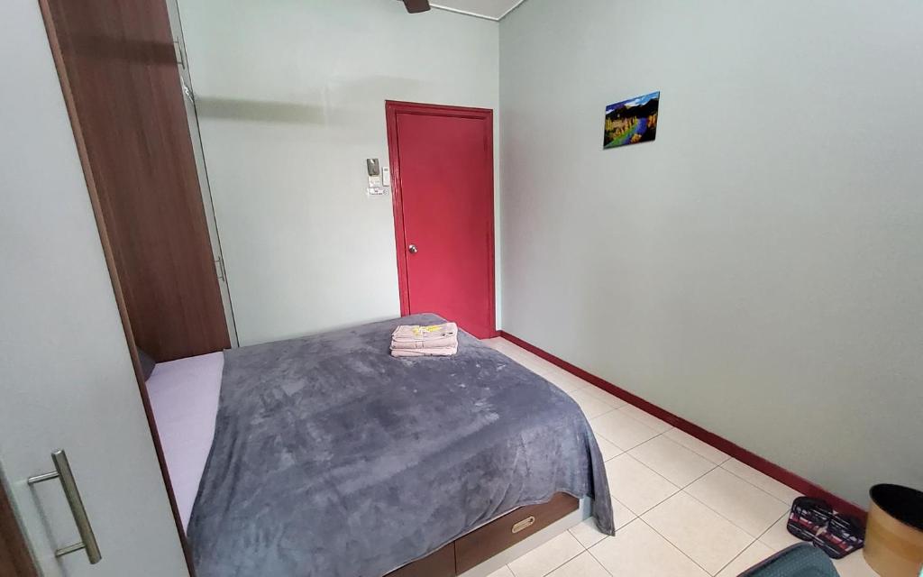Postel nebo postele na pokoji v ubytování Putrajaya Transit Romestay