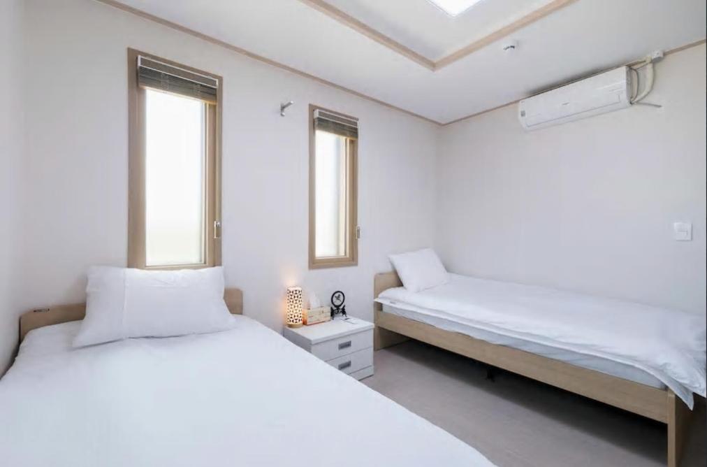 Postel nebo postele na pokoji v ubytování Hub Guest House