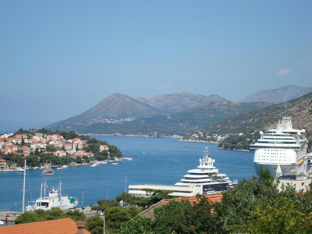a view of a harbor with two large cruise ships at Guesthouse S&L in Dubrovnik