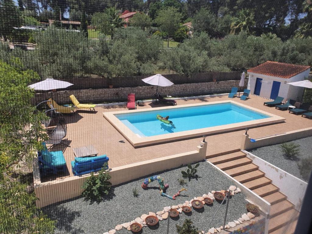 an overhead view of a swimming pool in a backyard at Finca La Higuera - Boutique B&B in Ontinyent