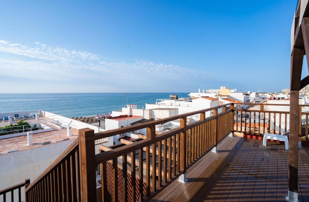 a balcony with a view of the ocean at APARTAMENTOS EL CARMEN Carihuela PLAYA in Torremolinos