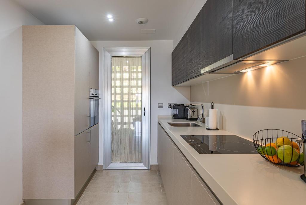 Kuchyň nebo kuchyňský kout v ubytování Garten Appartment in La Floresta - La Mairena