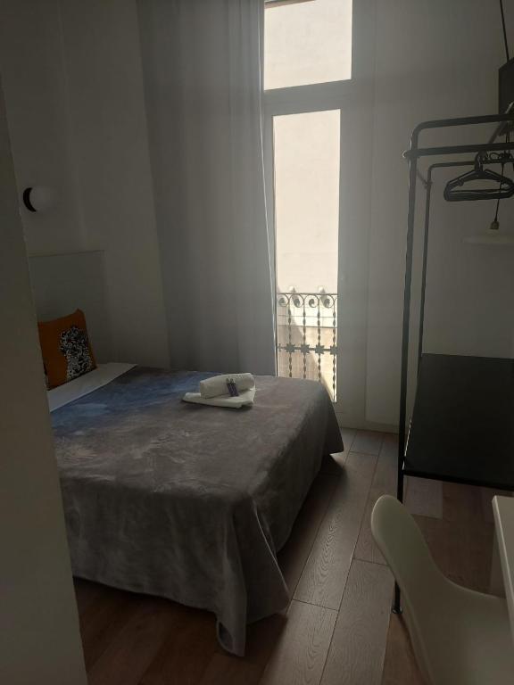 Posteľ alebo postele v izbe v ubytovaní Hostal Argo