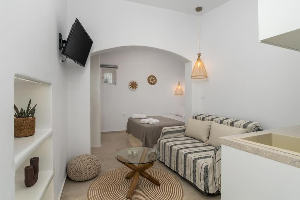 a living room with a couch and a table at Agathi's House in Triovasálos