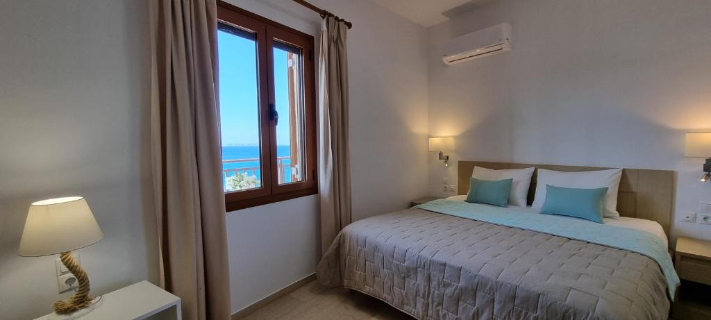 Postel nebo postele na pokoji v ubytování Simon Sea View