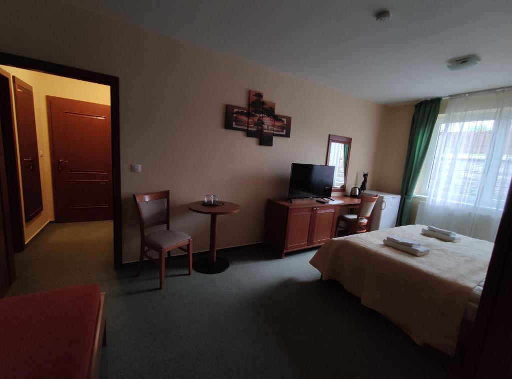 Postel nebo postele na pokoji v ubytování Rezidencia Edenium