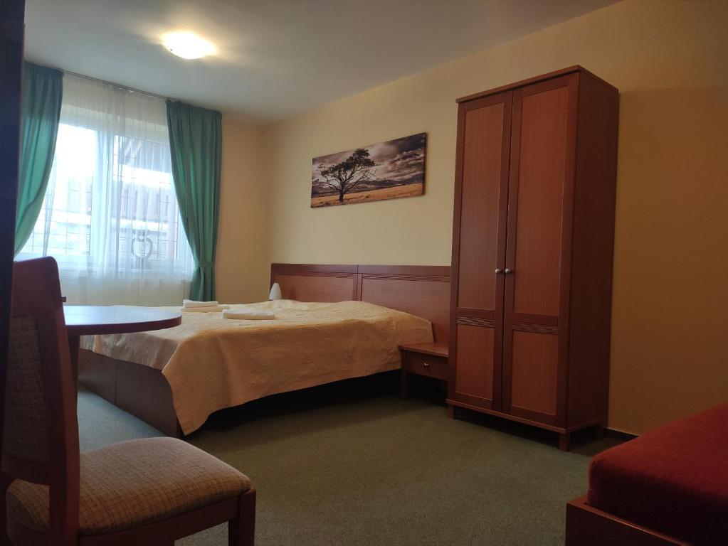 Postel nebo postele na pokoji v ubytování Rezidencia Edenium