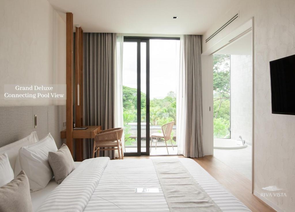 Postel nebo postele na pokoji v ubytování Riva Vista Riverfront Resort Chiang Rai
