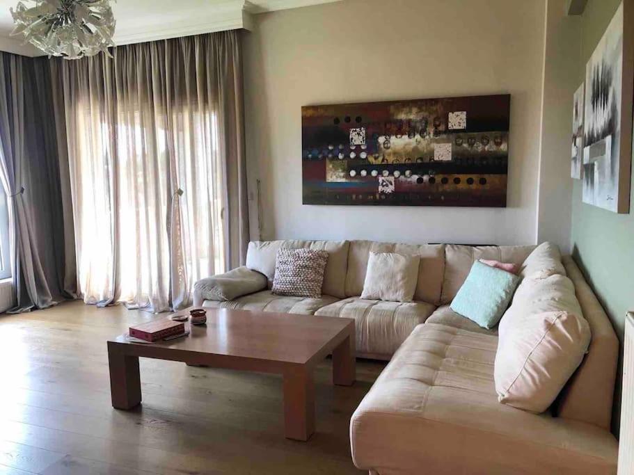 a living room with a couch and a coffee table at Villa Casa Chrissy in Plagiárion