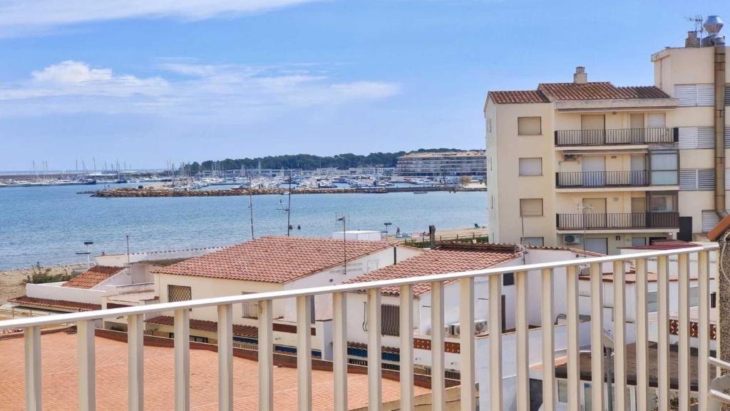 a balcony of a building with a view of the water at Apartamento Costamar by VACAY L'Escala in L'Escala