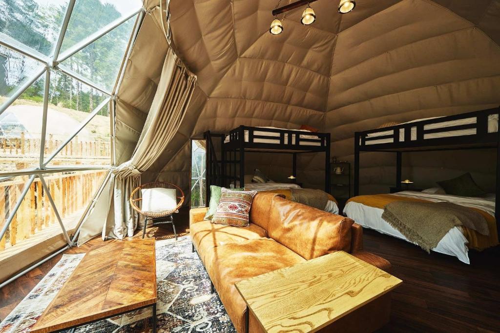 Postel nebo postele na pokoji v ubytování GLAMPING GATE 奈良