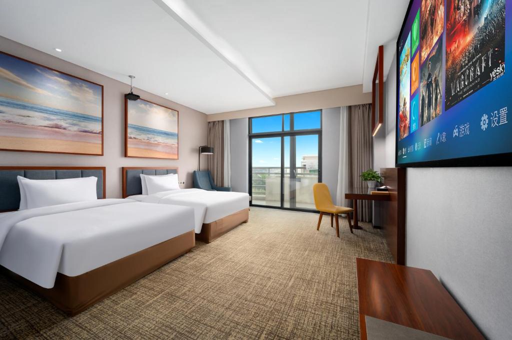 Кровать или кровати в номере Ausotel Smart Baiyun International Airport T2