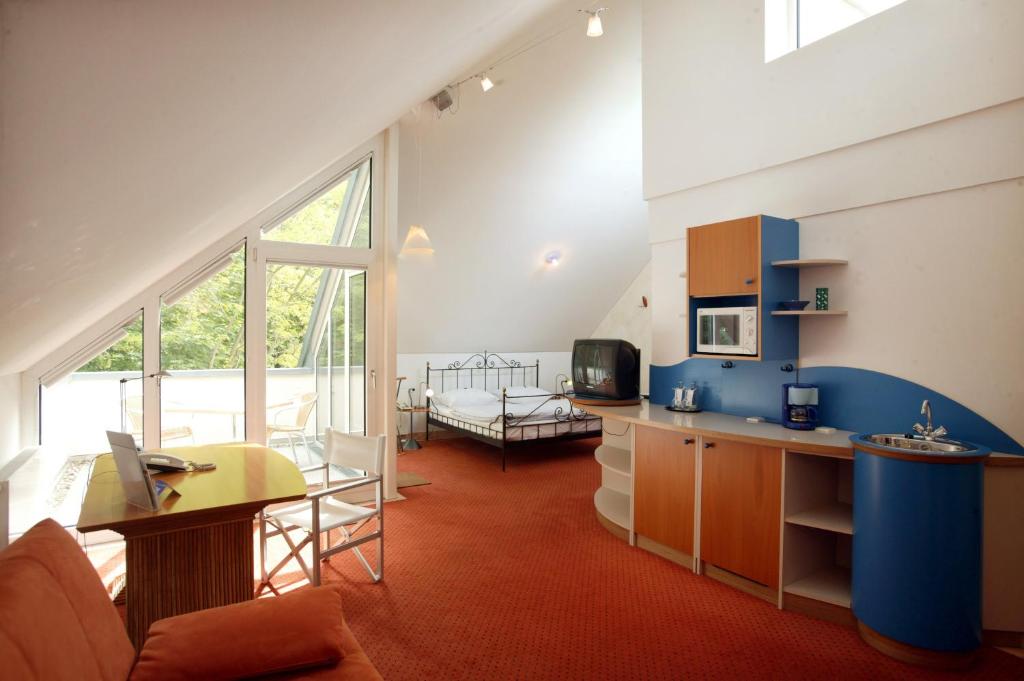 Kuchyň nebo kuchyňský kout v ubytování Hotel Watthalden