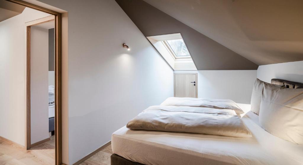 Postel nebo postele na pokoji v ubytování freiraum Apartments