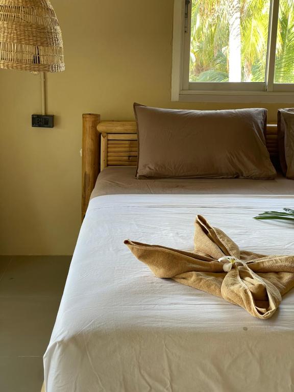 מיטה או מיטות בחדר ב-Mythai Guesthouse