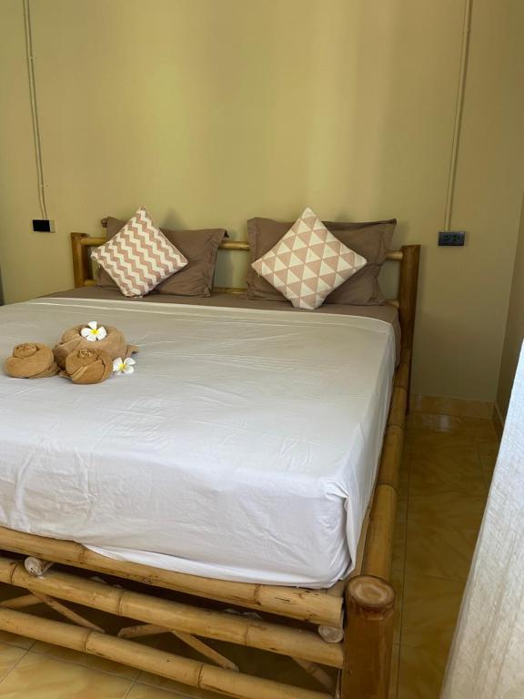 Postel nebo postele na pokoji v ubytování Mythai Guesthouse