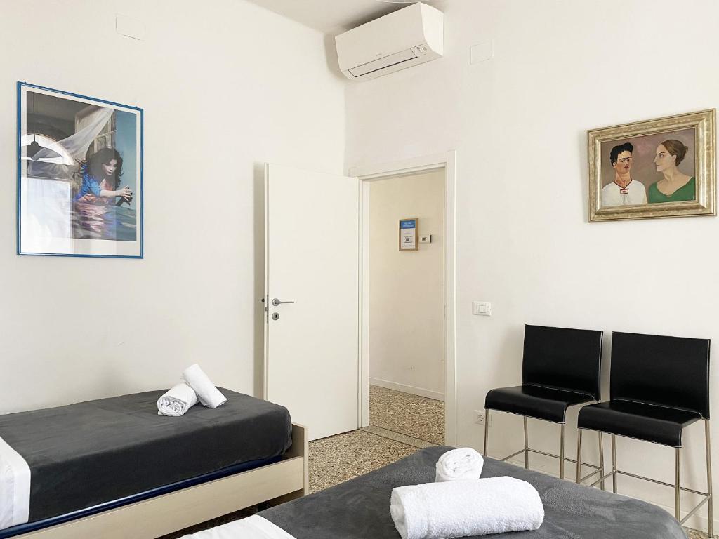 Posteľ alebo postele v izbe v ubytovaní Ca' Girolamo Apartment