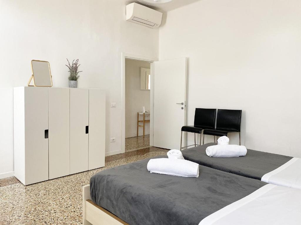 Posteľ alebo postele v izbe v ubytovaní Ca' Girolamo Apartment