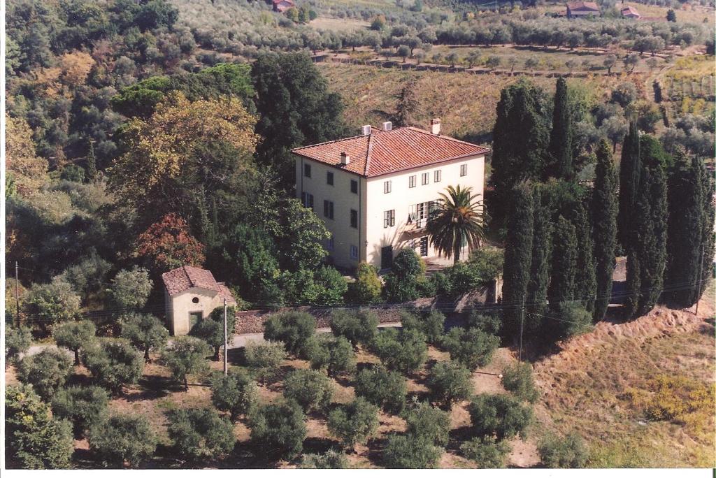 an aerial view of a house on a hill with trees at Villa Pedone in Lucca