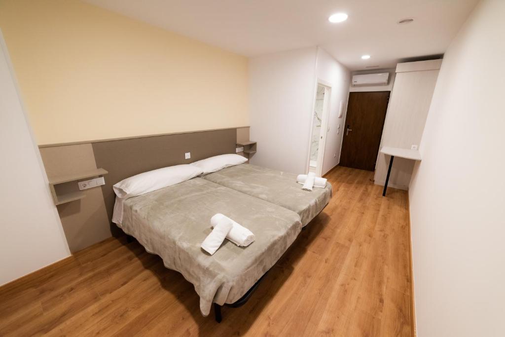 A bed or beds in a room at ESTRELA DO CAMIÑO