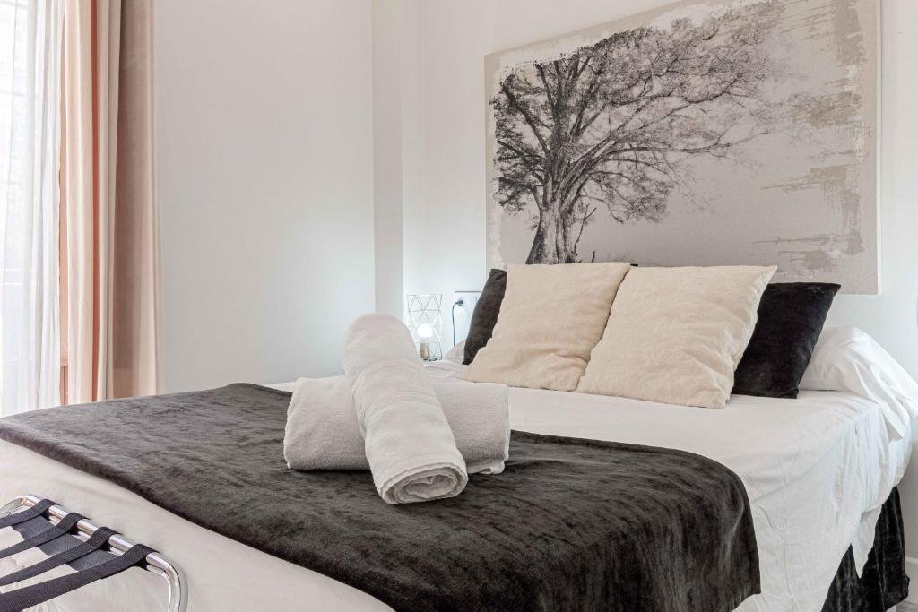 Posteľ alebo postele v izbe v ubytovaní Apartamentos Recaredo 7 , 2ª planta