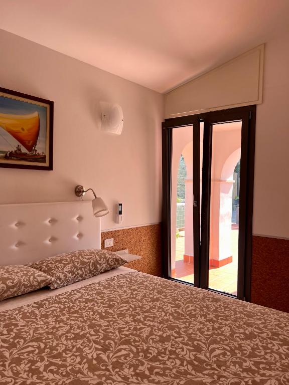 Postel nebo postele na pokoji v ubytování Terramata Resort Case Vacanza