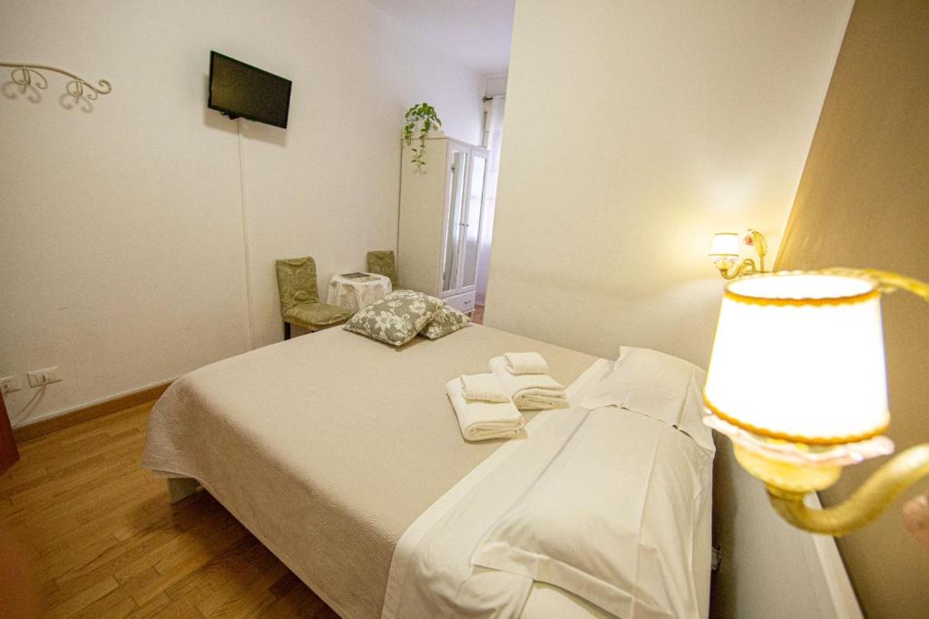 Postel nebo postele na pokoji v ubytování B&B Happiness - City Center