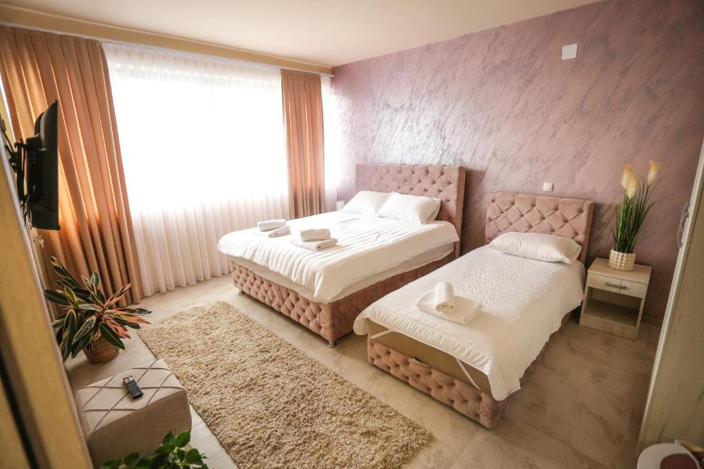 Postel nebo postele na pokoji v ubytování Smestaj Paramun