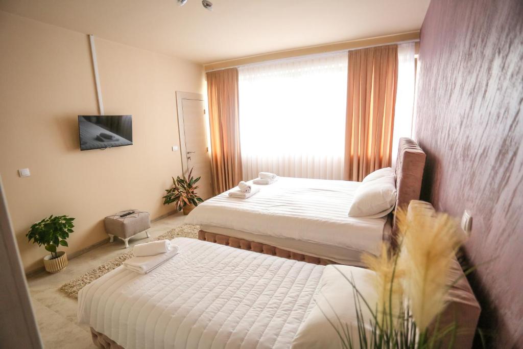Postel nebo postele na pokoji v ubytování Smestaj Paramun