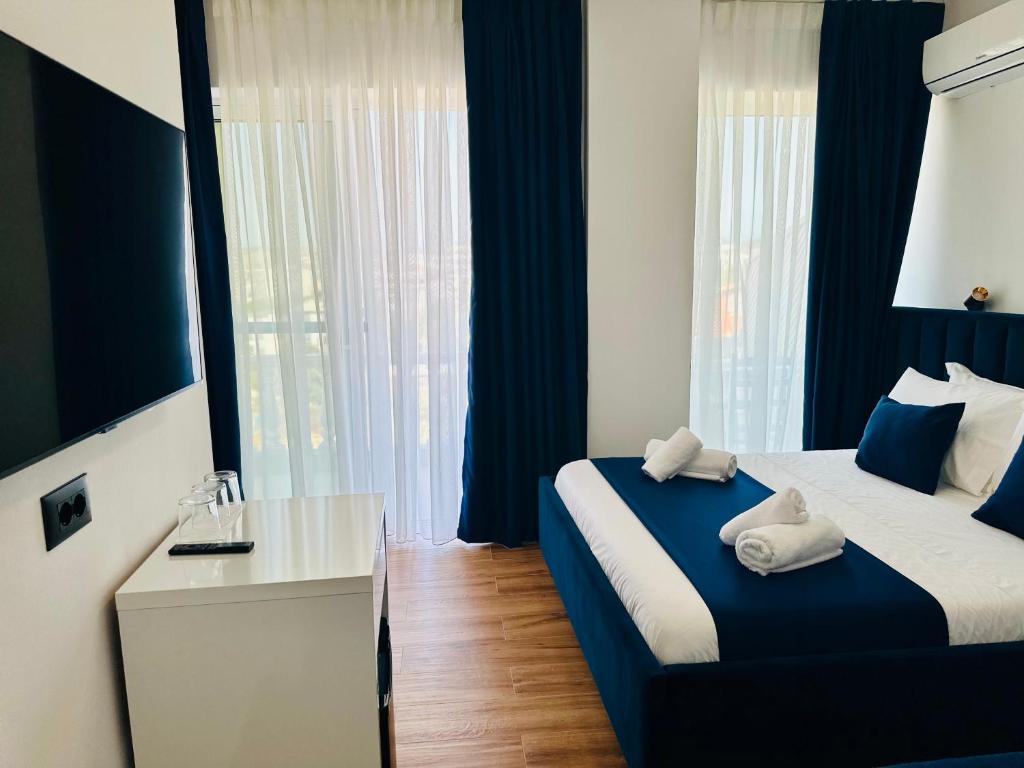 Cama o camas de una habitación en ILLYRIAN hotel Ksamil