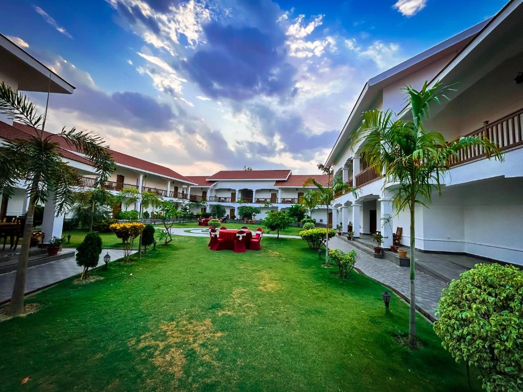 an image of a courtyard of a hotel at Hotel Earth Light Sauraha in Chitwan