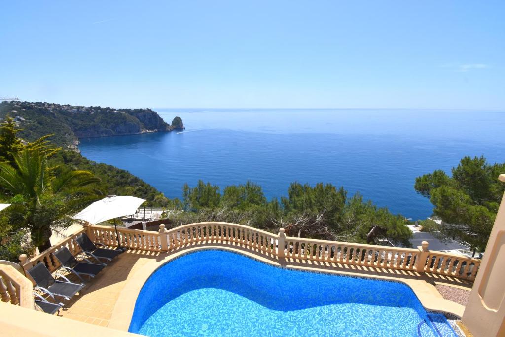a view of the ocean from a villa with a swimming pool at Casa Bonavista in Jávea
